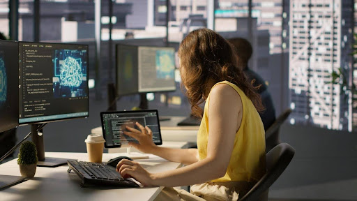 Woman working on her laptop with AI.