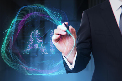 Human with a pen drawing the letters AI